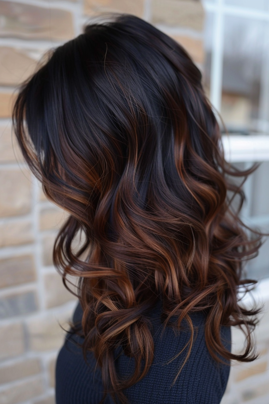 Balayage hairstyle. Deep mocha roots with caramel highlights.