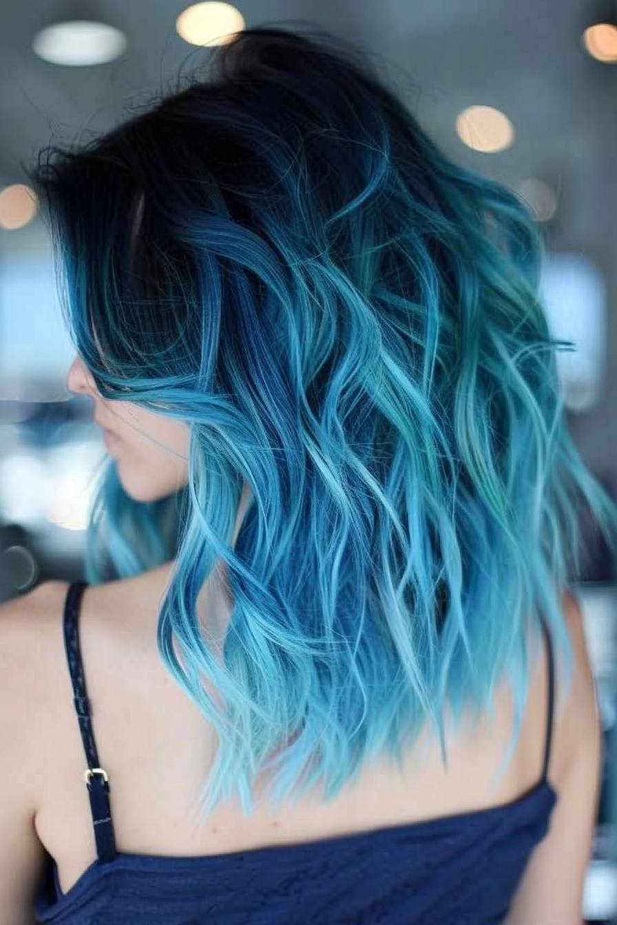 Blue Hair Color Woman Hairstyle. Ombre bob with navy roots and turquoise ends.