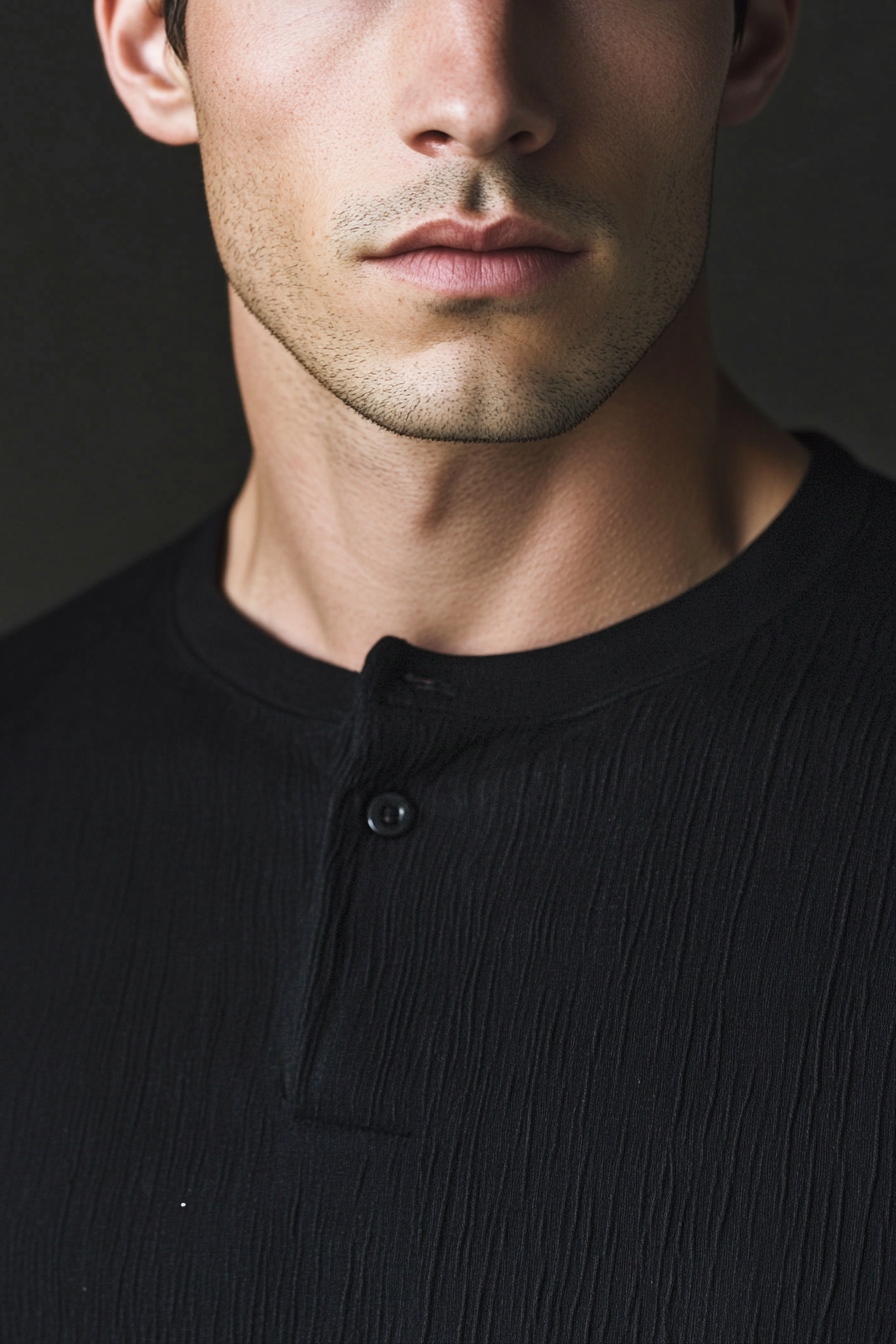 Men's contemporary style. Dark colored, textured top with clean, blended sides.