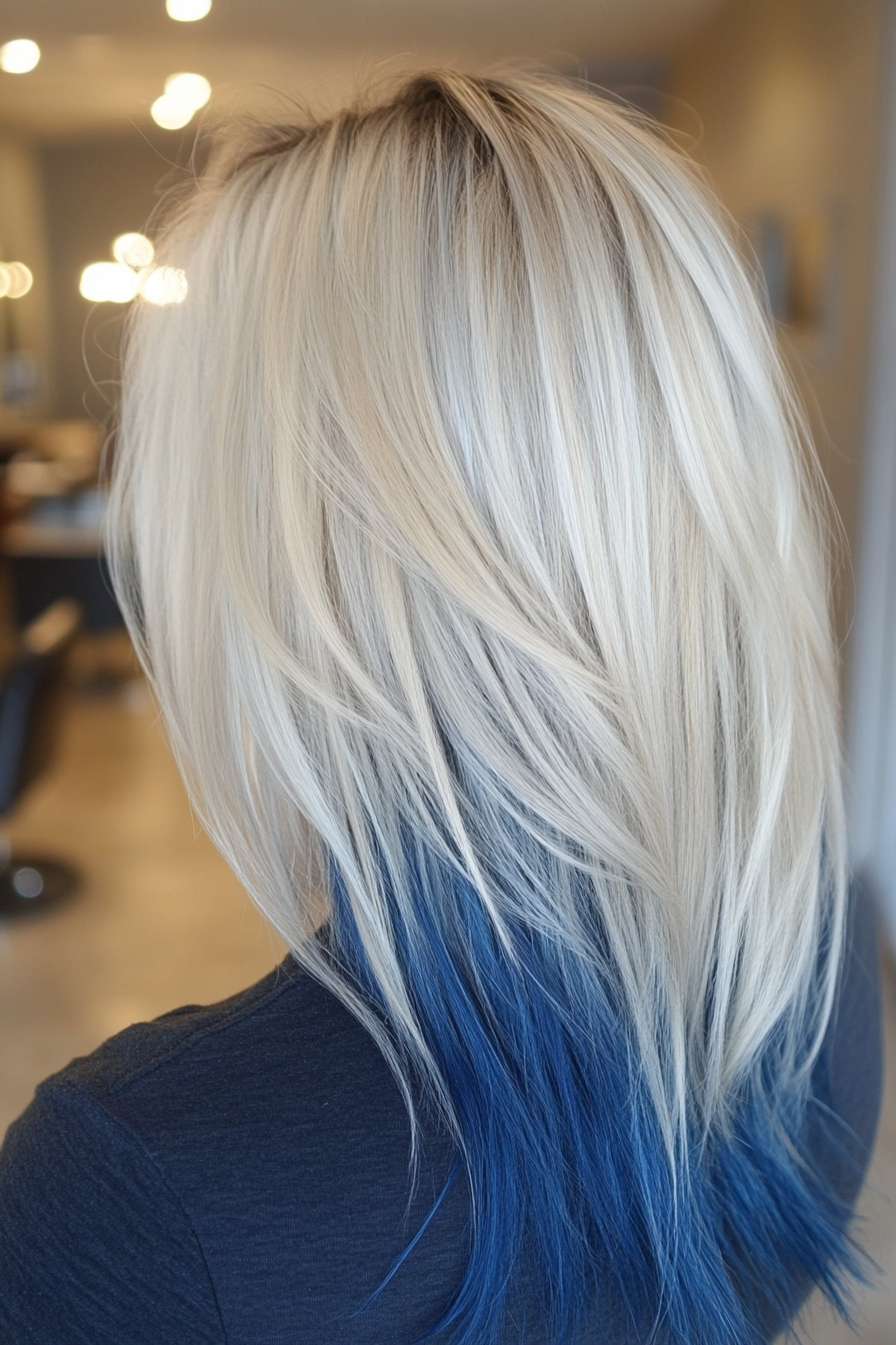 Women's hair color. Midnight blue roots fading into icy silver, regular touch ups.