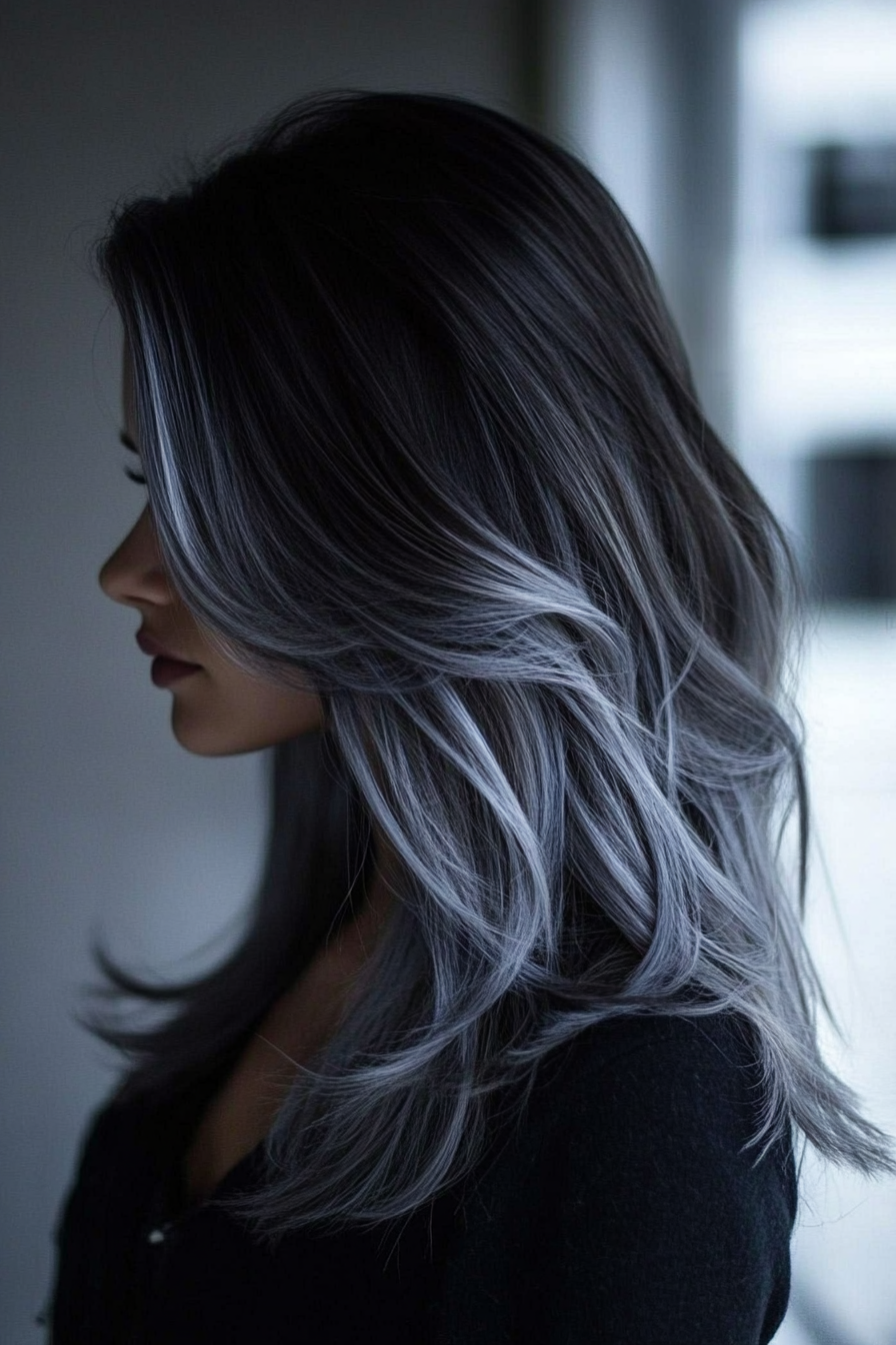 Women's hair color. Dark brown roots with silver toned balayage and daily nourishing conditioner.