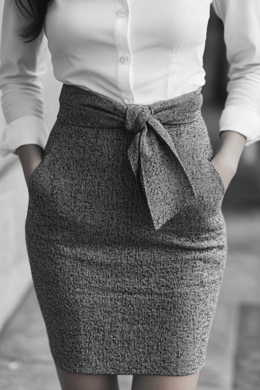 Classic styled women's fashion. Pencil skirt with chic button-down tied at the waist.